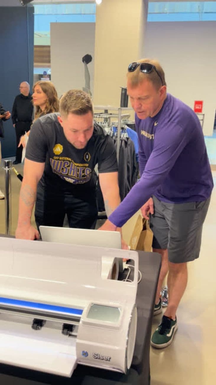Live personalization station inside an Adidas store with fans waiting for custom shirts
