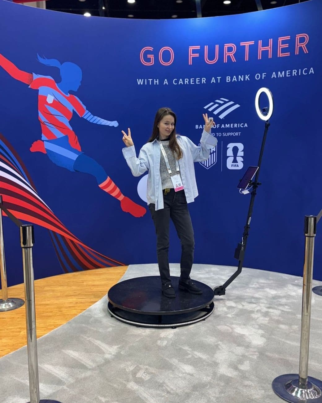 Guest on a 360 photo booth platform inside a Bank of America career-fair booth