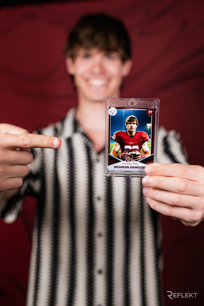 Guest holding his personalized trading card